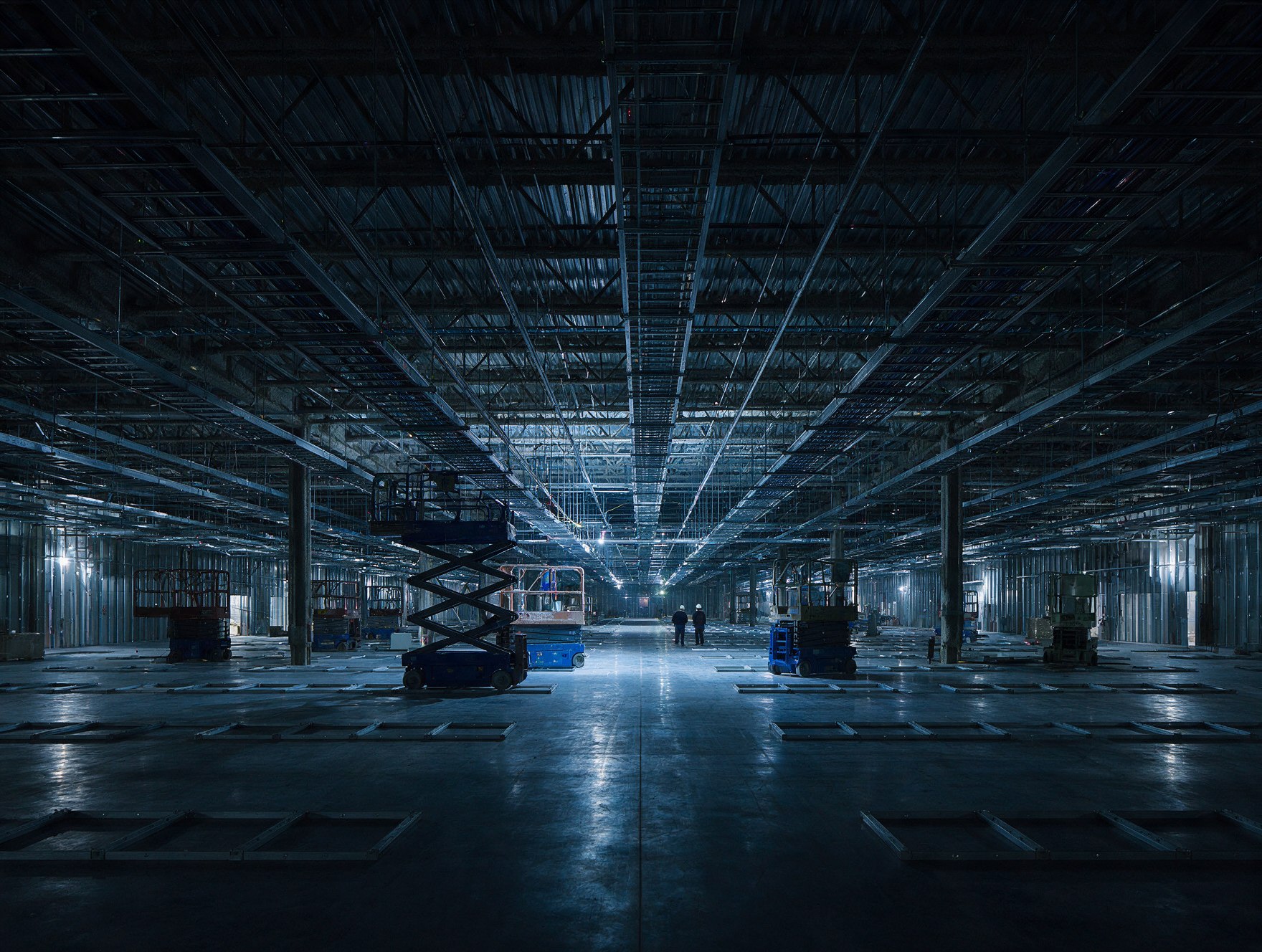 Data hall under construction with cable tray and busway being installed